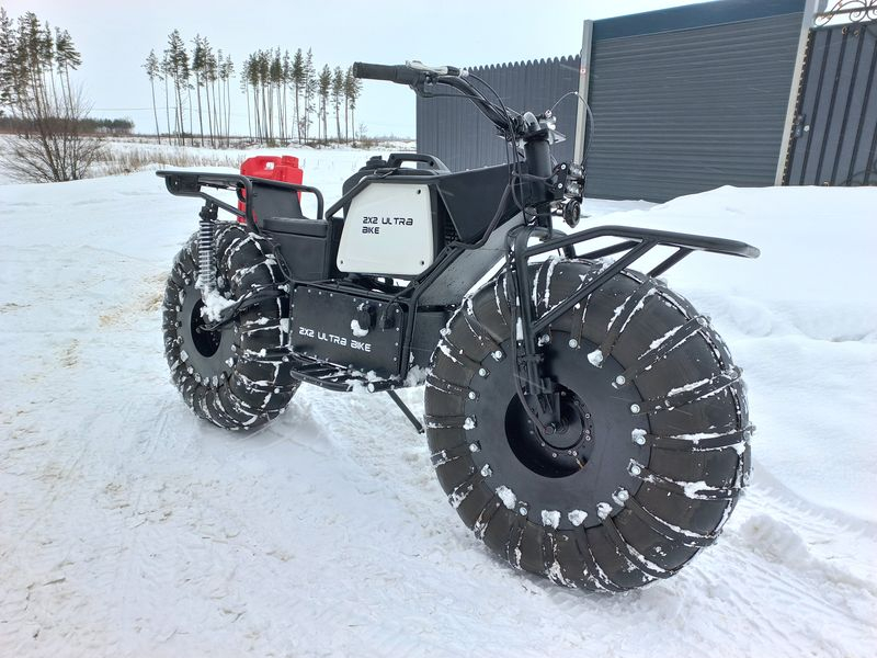 This all-terrain motorcycle stores fuel in its wheel rims
